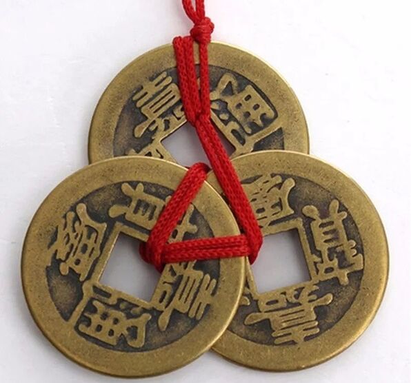 coins with red thread for good luck